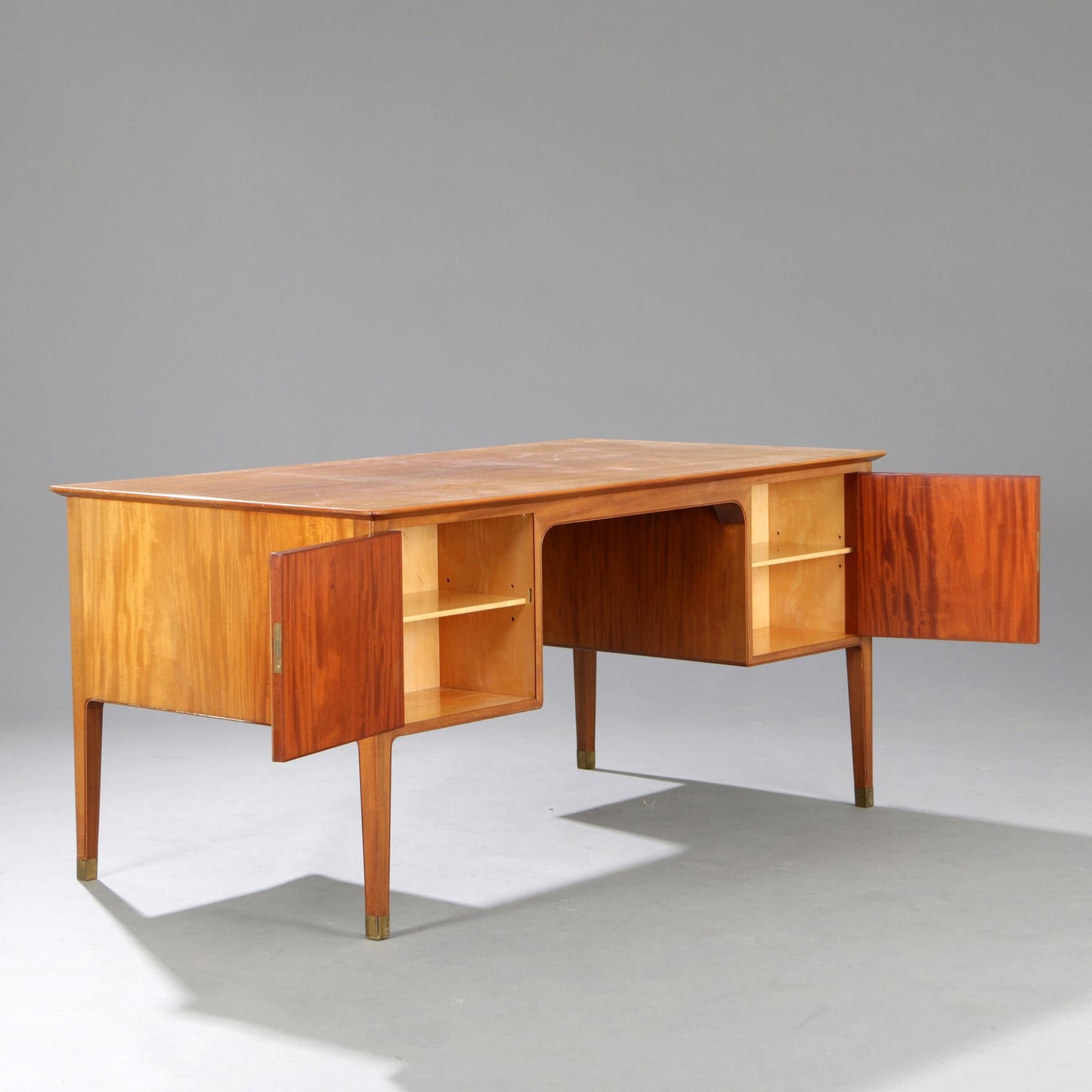 Gustav Bertelsen desk with brass shoes and six drawers