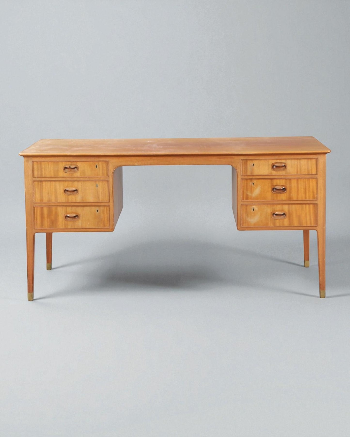 1950s Gustav Bertelsen desk with brass shoes and six drawers