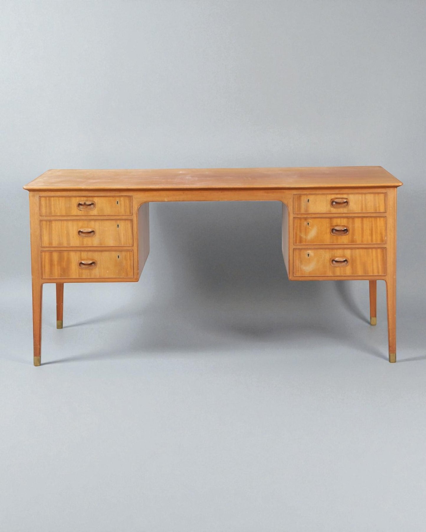 1950s Gustav Bertelsen desk with brass shoes and six drawers