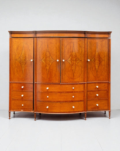 EDWARDIAN SATINWOOD INLAID AND CROSSBANDED SERPENTINE FRONTED WARDROBE