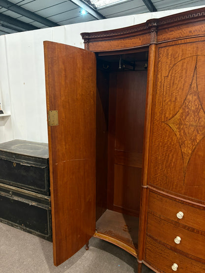 EDWARDIAN SATINWOOD INLAID AND CROSSBANDED SERPENTINE FRONTED WARDROBE