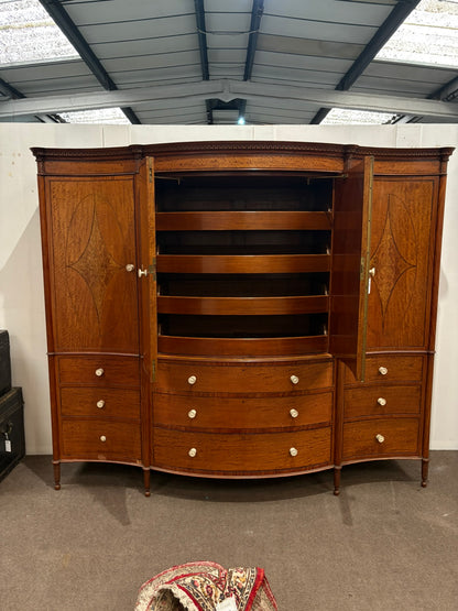 EDWARDIAN SATINWOOD INLAID AND CROSSBANDED SERPENTINE FRONTED WARDROBE