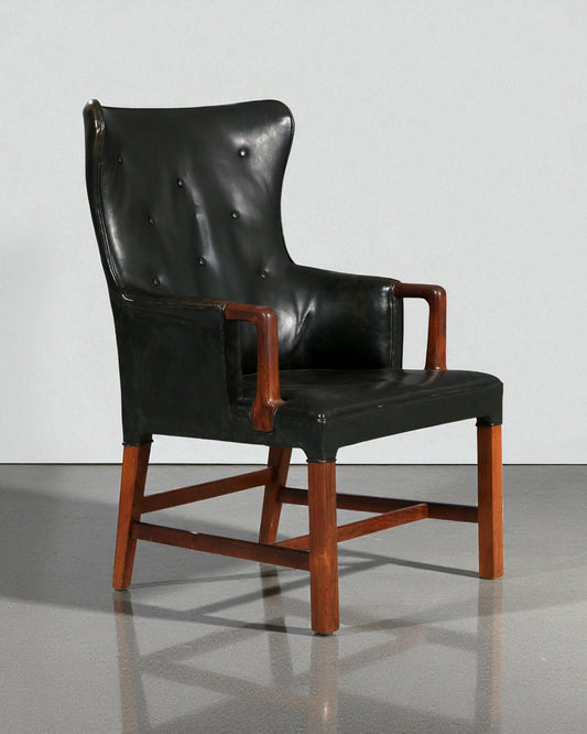 Peter Hvidt: Armchair of Rosewood and Black Leather circa 1955